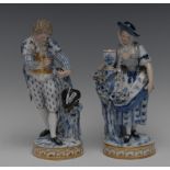 A pair of Meissen figures, of a gentleman and lady, both in 18th century,