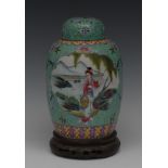 A Chinese ginger jar and cover, decorated with two shaped reserves containing oriental figures,