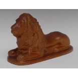 A 19th century Derbyshire brown salt glazed stoneware model, of a recumbent lion, oval base,