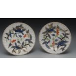 A pair of Derby shaped circular Imari plates, painted with stylised leaves, picked out in gilt,