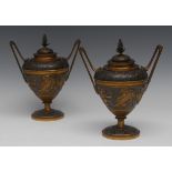 A pair of 19th century French gilt and dark patinated bronze ovoid mantel urns and covers,