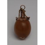 A 19th century gold coloured metal mounted nut gourd scent bottle,