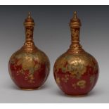 A pair of Derby Crown Porcelain lobed bottle vases and covers, in the Persian taste,