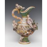 A Continental porcelain ewer, in relief with stag and boar hunt, surmounted with Pan,