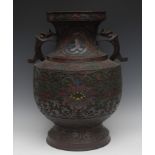 A large Japanese bronze and cloisonne vase, enamelled in red,