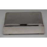 An Art Deco silver bowed rectangular cigarette box,