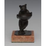 A 19th century bronze novelty trinket stand, cast as a bear holding a large pan,