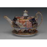 A Chamberlain Worcester teapot, cover and stand, decorated in the Imari palette, scroll handle,