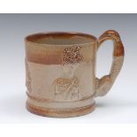 A 19th century brown salt glazed stoneware commemorative mug,