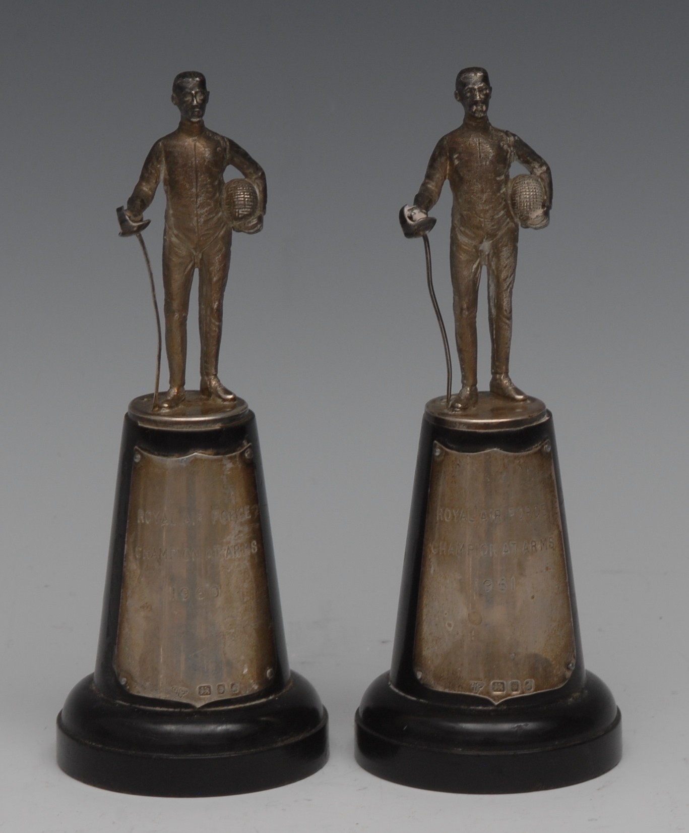 Fencing - a pair of Elizabeth II silver figures, cast as combatants with mask and foil,