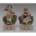 A pair of 19th century Bow type figures, of Musicians, he with cymbols, she with a lute,