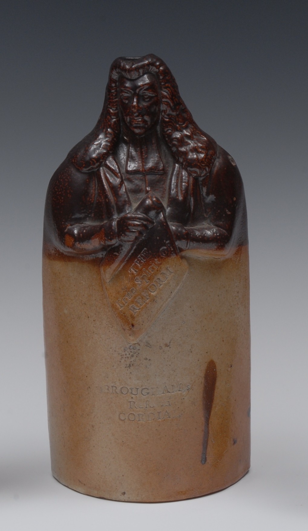 A 19th century Doulton Lambeth salt glazed stoneware figural reform flask, Brougham Reform Cordial,