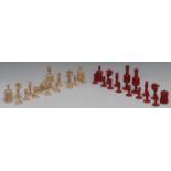 A 19th century turned bone chess set , stained red and natural, the kings 9.5cm high, c.