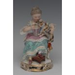 A Meissen figure, of an elderly lady seated, feeding a cat, in pastel colours, pierced scroll base,