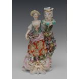 A Derby Patch Mark figural candlestick, The Flower Seller,