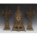 A flamboyant French Third Republic gilt metal clock garniture,