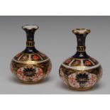 A pair of Royal Crown Derby 1128 bottle vases, wavy rims, 8cm high, printed marks,