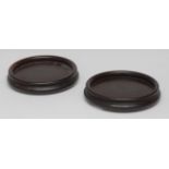 A pair of George III turned mahogany wine coasters, quite plain, 16cm diam, c.