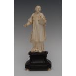 A 19th century Dieppe ivory figure, well carved as Christ preaching, book in hand,