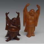 A Chinese boxwood carving, of Hotai, he stands, smiling, with arms up stretched, 15.