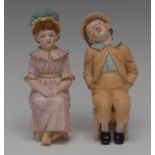 A pair of Royal Worcester blush ivory figure, modelled by James Hadley after Kate Greenaway,