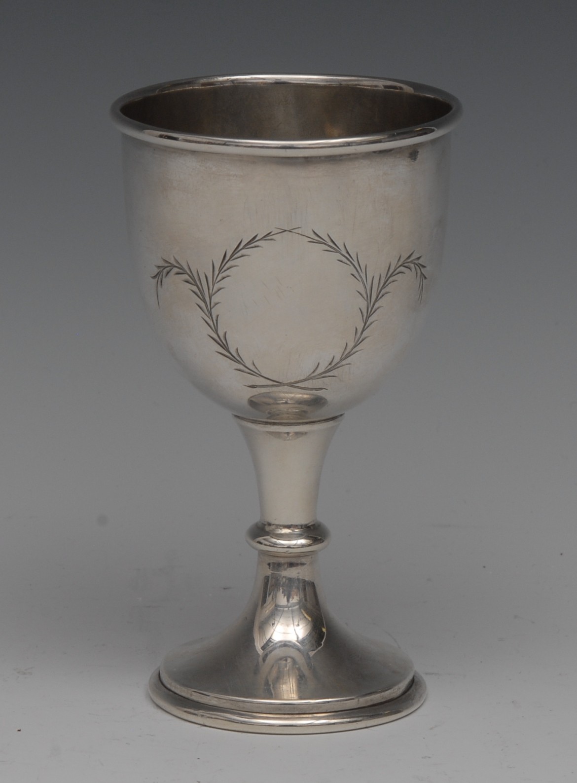 An Elizabeth II silver pedestal goblet, hemi-ovoid bowl engraved with a vacant laurel cartouche, 12.