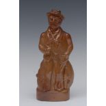 A 19th century brown salt glazed stoneware flask, as a sailor, standing holding a pipe, 21cm high,