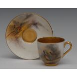 A Royal Worcester cabinet cup and saucer, painted by Jas Stinton, signed, with pheasants,