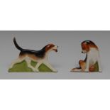 A pair of Royal Worcester Hunting menu holders, of fox hounds, one standing, the other seated,