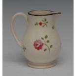 A Wedgwood creamware sparrow beak jug, painted with scattered flower sprays, black line rim,