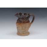 A mid 19th century brown salt glazed stoneware commemorative jug,