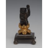 Continental School (19th century), a dark patinated and gilt cabinet bronze, of a dancing bear,