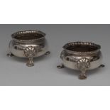 A pair of 18th century Dutch silver cauldron salts, gadrooned rims, pad feet with shells to knees,