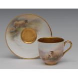 A Royal Worcester cabinet cup and saucer, painted by Harry Davis, signed, with black faced sheep,