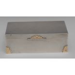 An Art Deco style 9ct gold mounted silver table cigar box, engine turned overall,