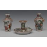 A pair of small Chinese vases, decorated with oriental figures, the shoulders with stylised foliage,