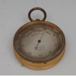 A Victorian gilt brass aneroid pocket barometer, 4.