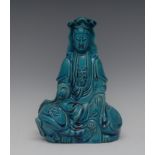 A Chinese monochrome figure, of Guanyin, in turquoise, in typical pose, 21cm high,