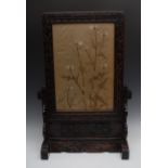 A Chinese hardwood table screen, the rectangular banner with silk panel worked with teasels,