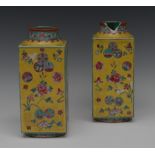 A pair of Chinese square slab sided vases, decorated with mons, peonies and floral sprigs,