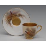 A Royal Worcester cabinet cup and saucer, painted by Jas Stinton, signed, with pheasants,