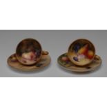 A pair of Royal Worcester cabinet cup and saucers, the cups painted by Bee and Roberts,