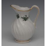 A Chelsea Derby wrythen moulded cream jug, applied with stiff leaves,