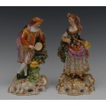 A pair of Derby figures, Musicians, both in fanciful dress, he with a tambourine,