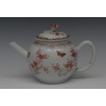 A Chinese globular teapot and cover, decorated with scrolling blossom and insects,