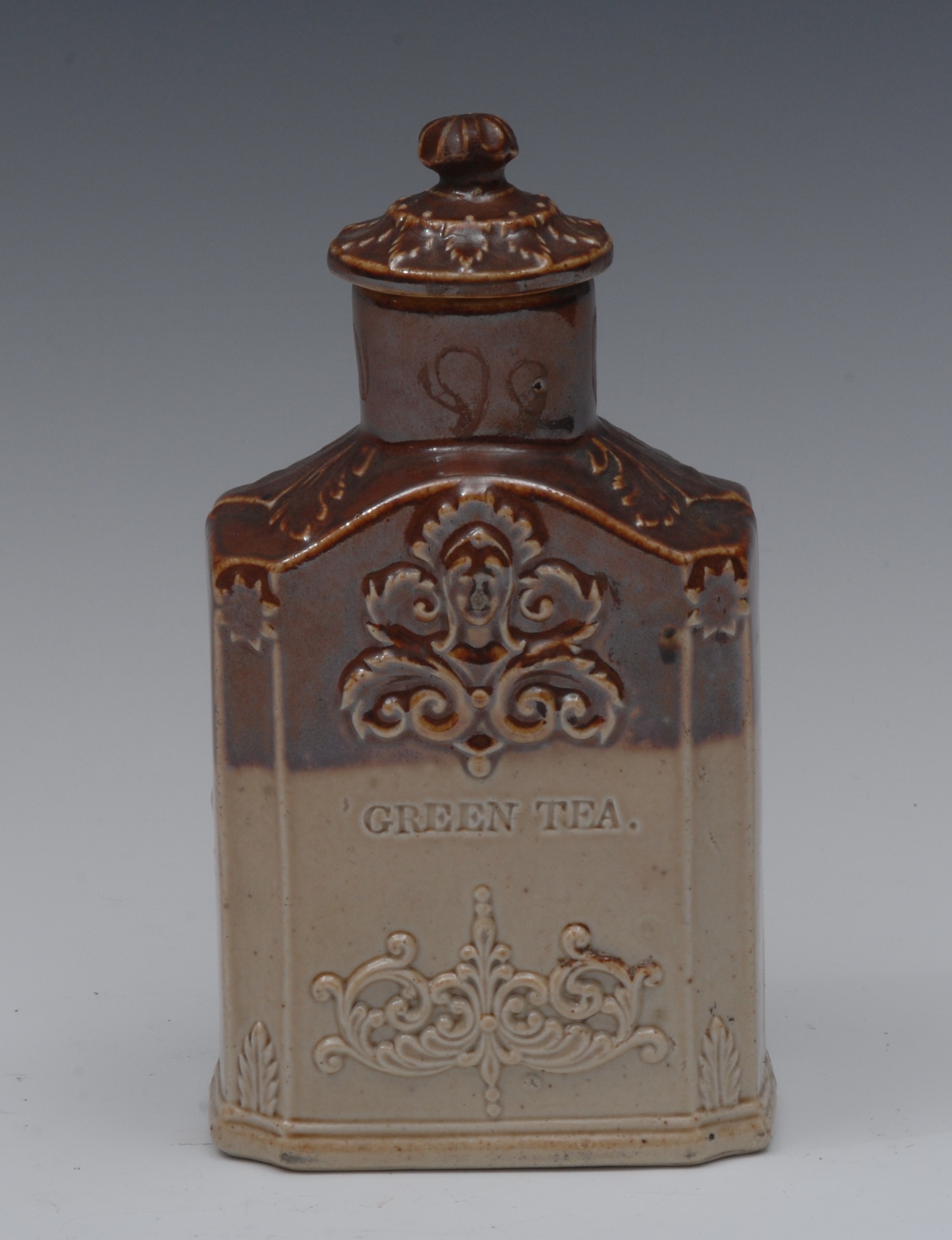 A 19th century brown salt glazed stoneware tea caddy and cover, inscribed Black Tea and Green Tea,