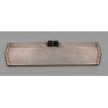 Asprey & Co - an Art Deco gold coloured metal mounted silver travelling comb, engine turned,