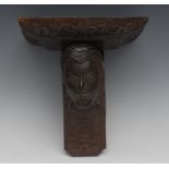 A 19th century oak wall bracket, rectangular plateau with acanthus border above a carved mask,