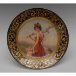 A Berlin circular plate, Son Troupeau, the beauty stands holding a blossoming branch,