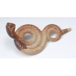 A 19th century brown salt glazed serpent pipe, the bowl formed as the head,